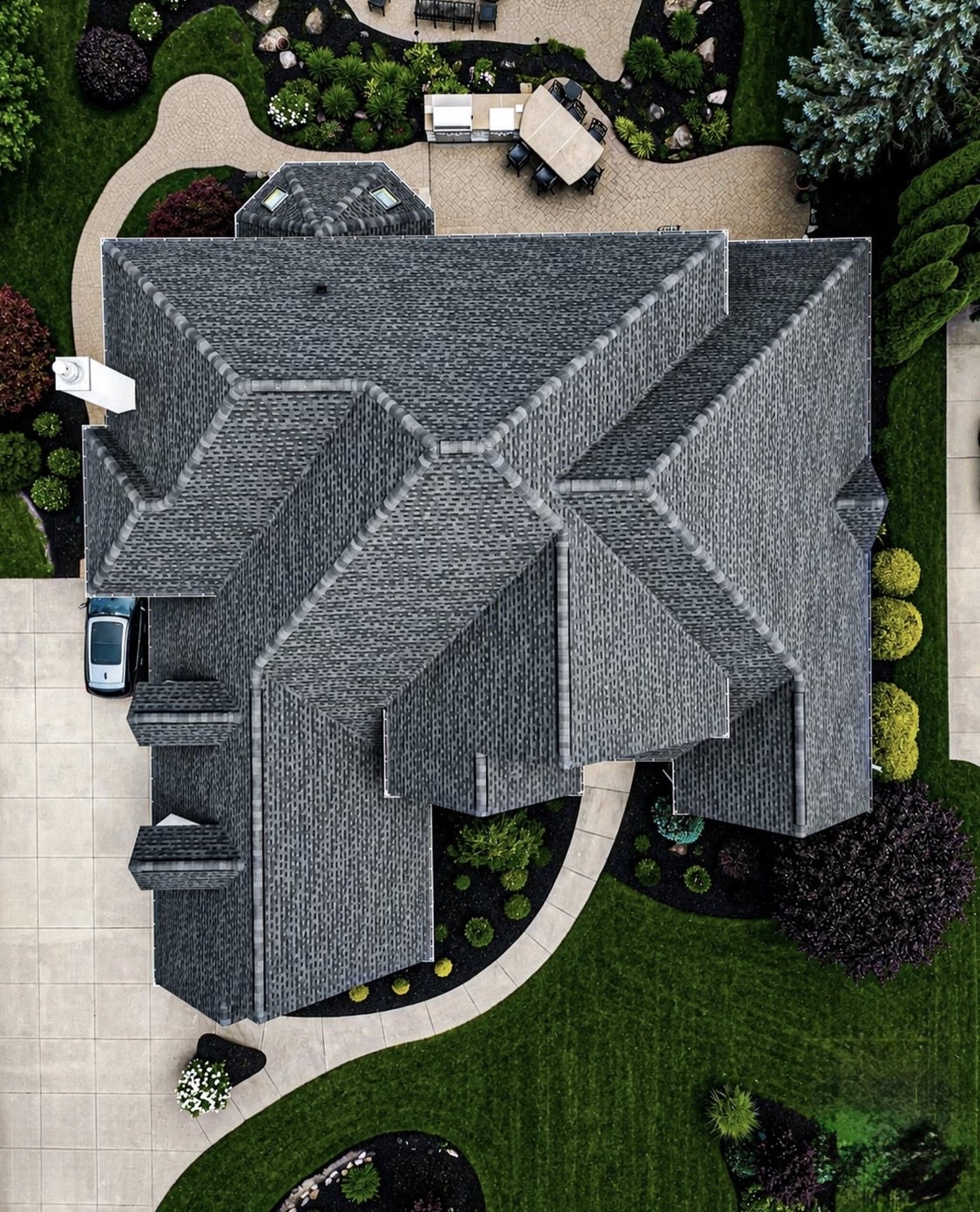 Aerial view of a completed gray shingle roof